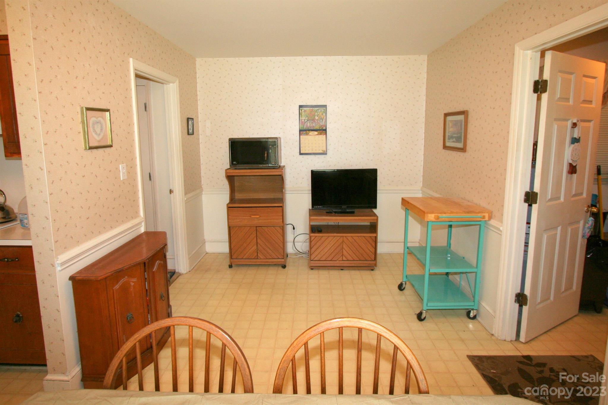 2813 Castlebrook Drive Monroe, NC 28112 - Photo 13 of 37 a living room with furniture and a flat screen tv