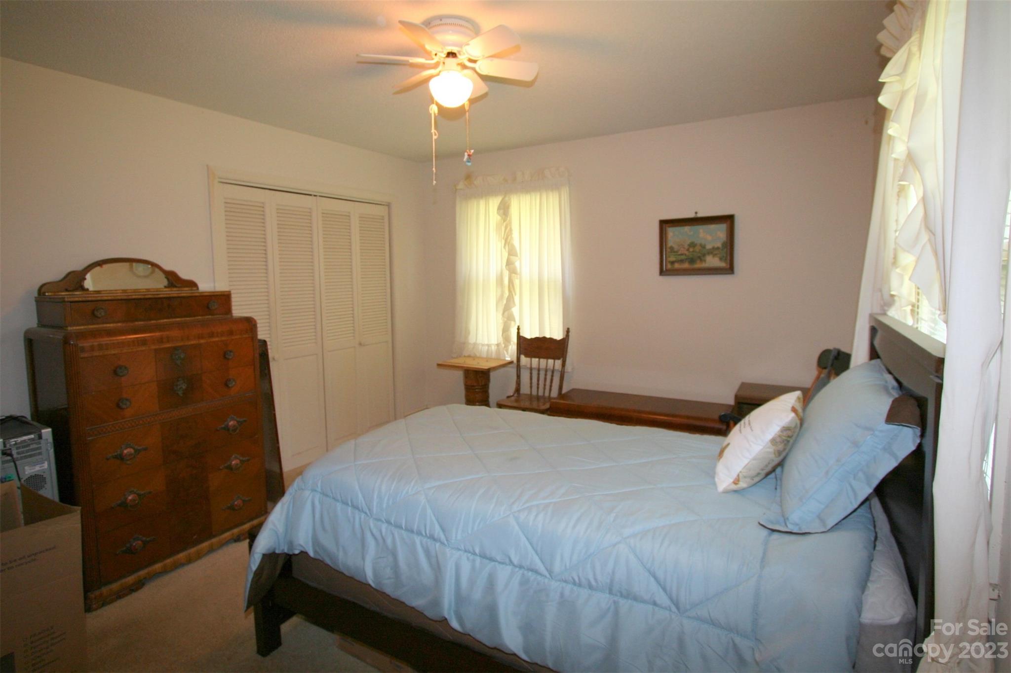 2813 Castlebrook Drive Monroe, NC 28112 - Photo 17 of 37 a bedroom with a bed and a chandelier