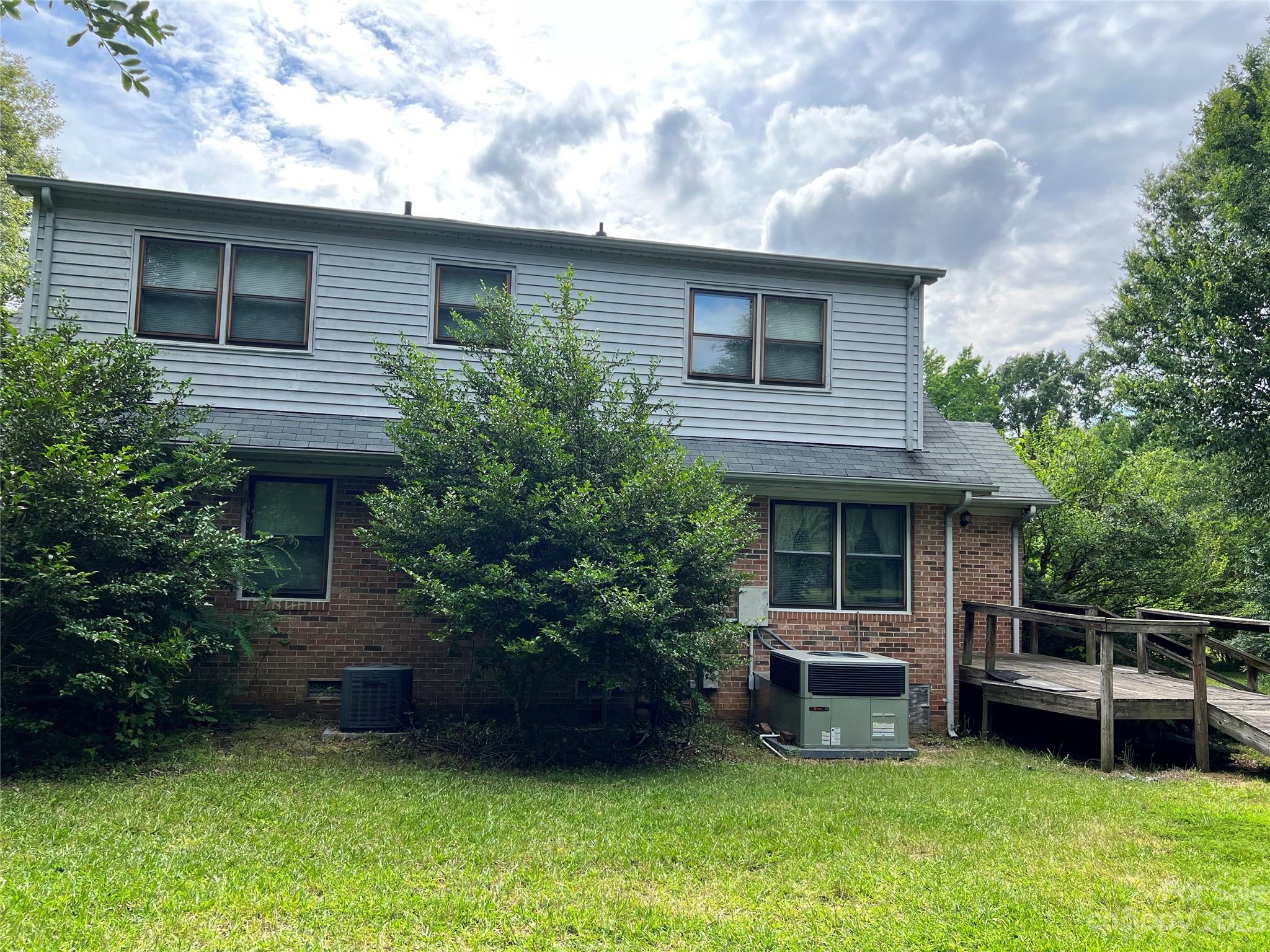 2813 Castlebrook Drive Monroe, NC 28112 - Photo 34 of 37 a house view with a sitting space and garden