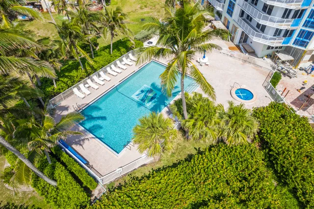 a view of swimming pool from a balcony