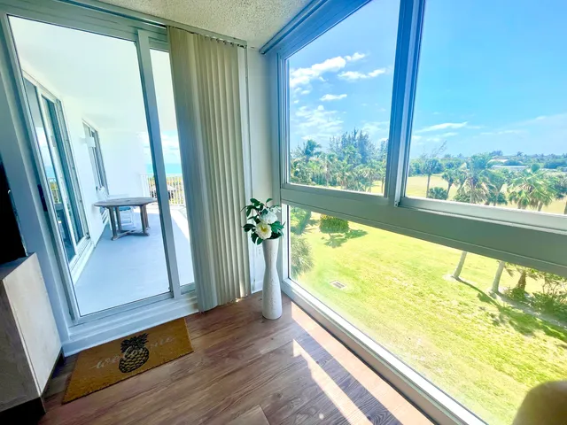 a view of large window with an outdoor space