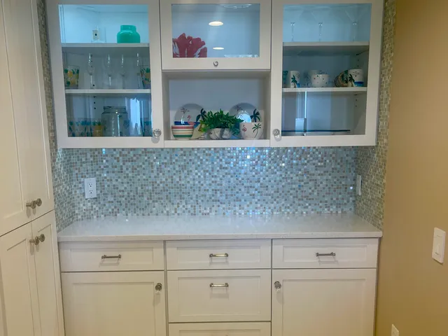 a view of mirror and cabinets