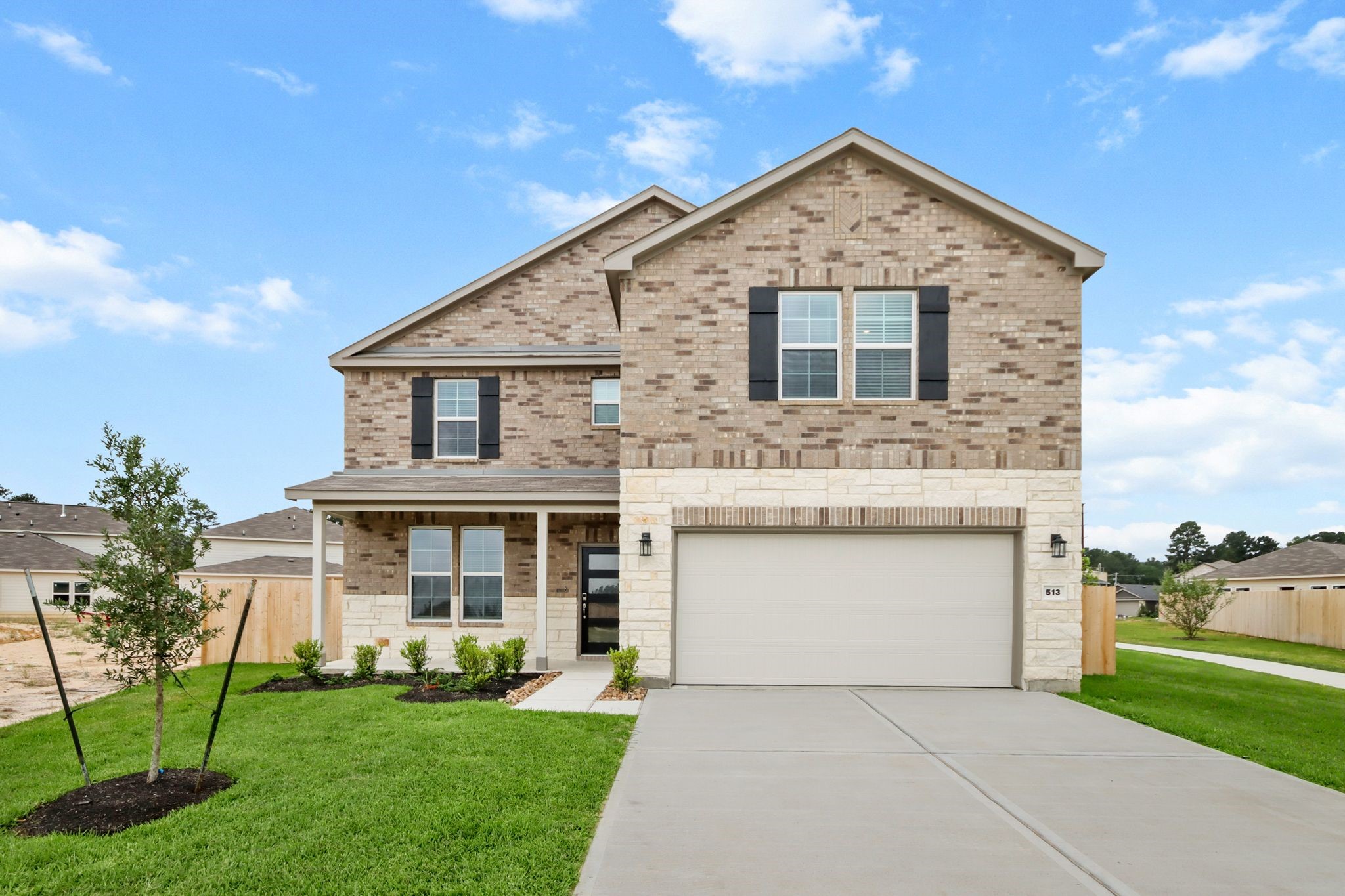 513 Wax Myrtle Way Hockley, TX 77447 - Photo 1 of 29 a front view of a house with a garden and yard