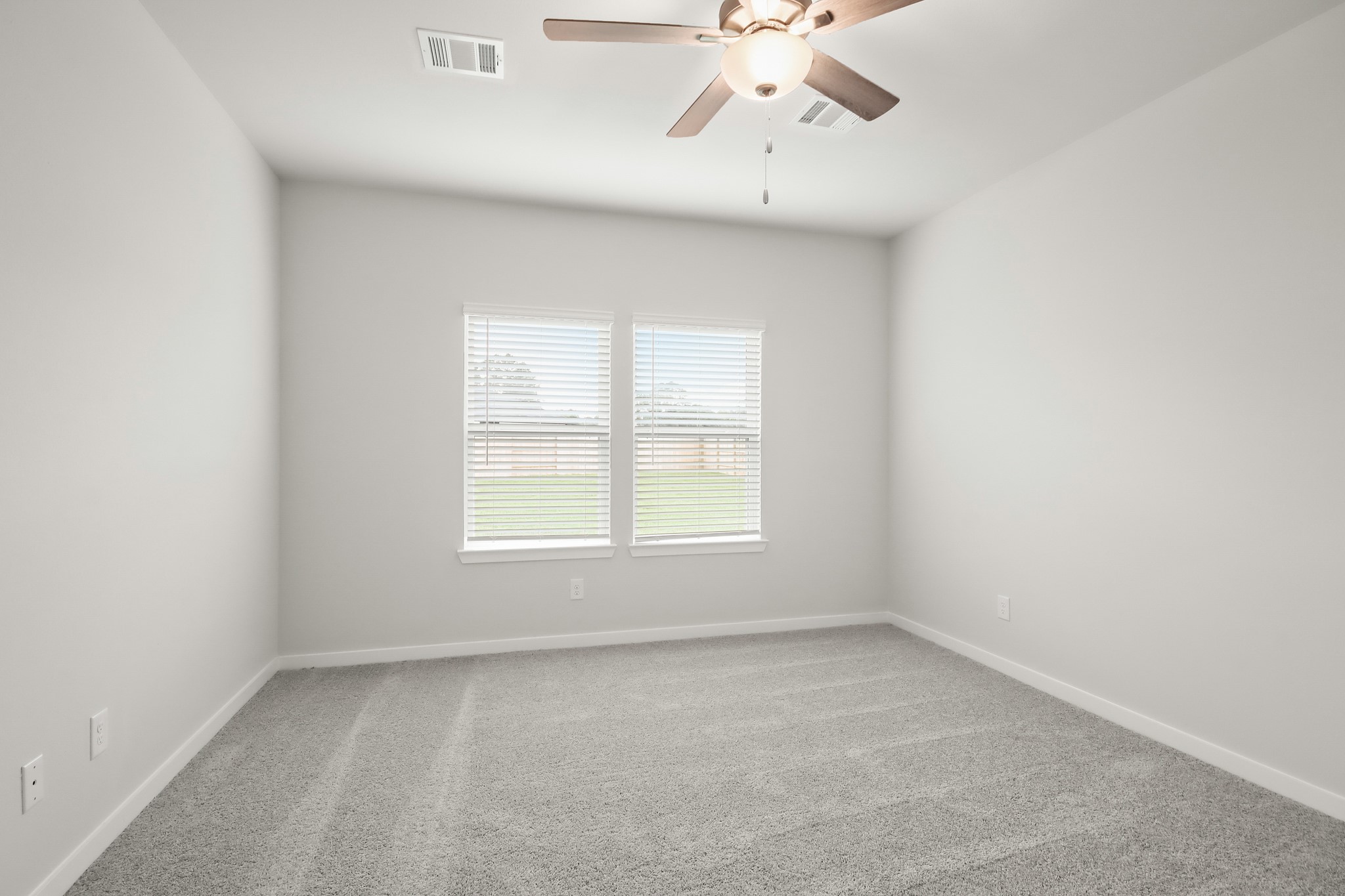 513 Wax Myrtle Way Hockley, TX 77447 - Photo 12 of 29 an empty room with a window and a fan