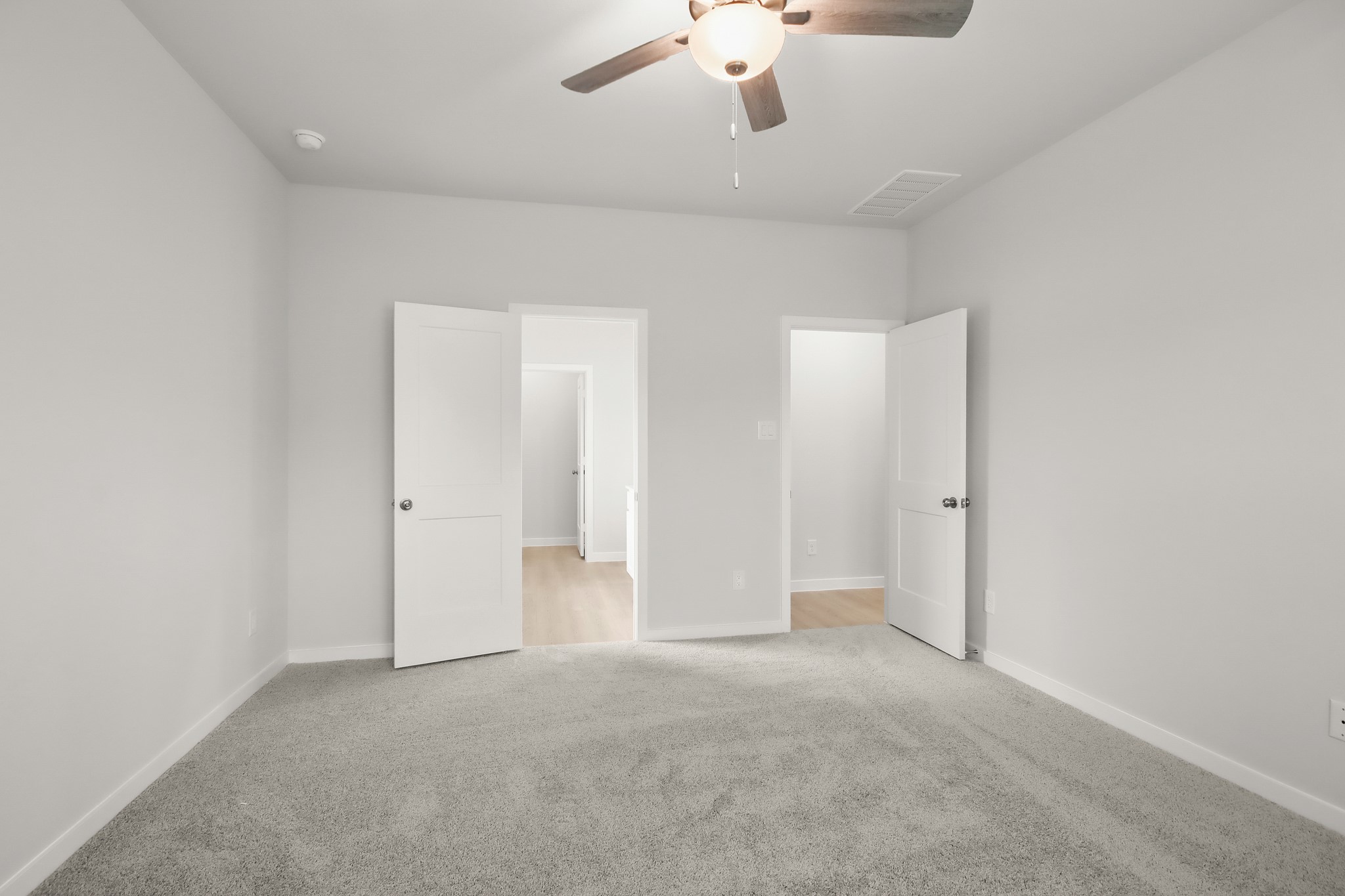 513 Wax Myrtle Way Hockley, TX 77447 - Photo 13 of 29 an empty room with a chandelier fan and windows