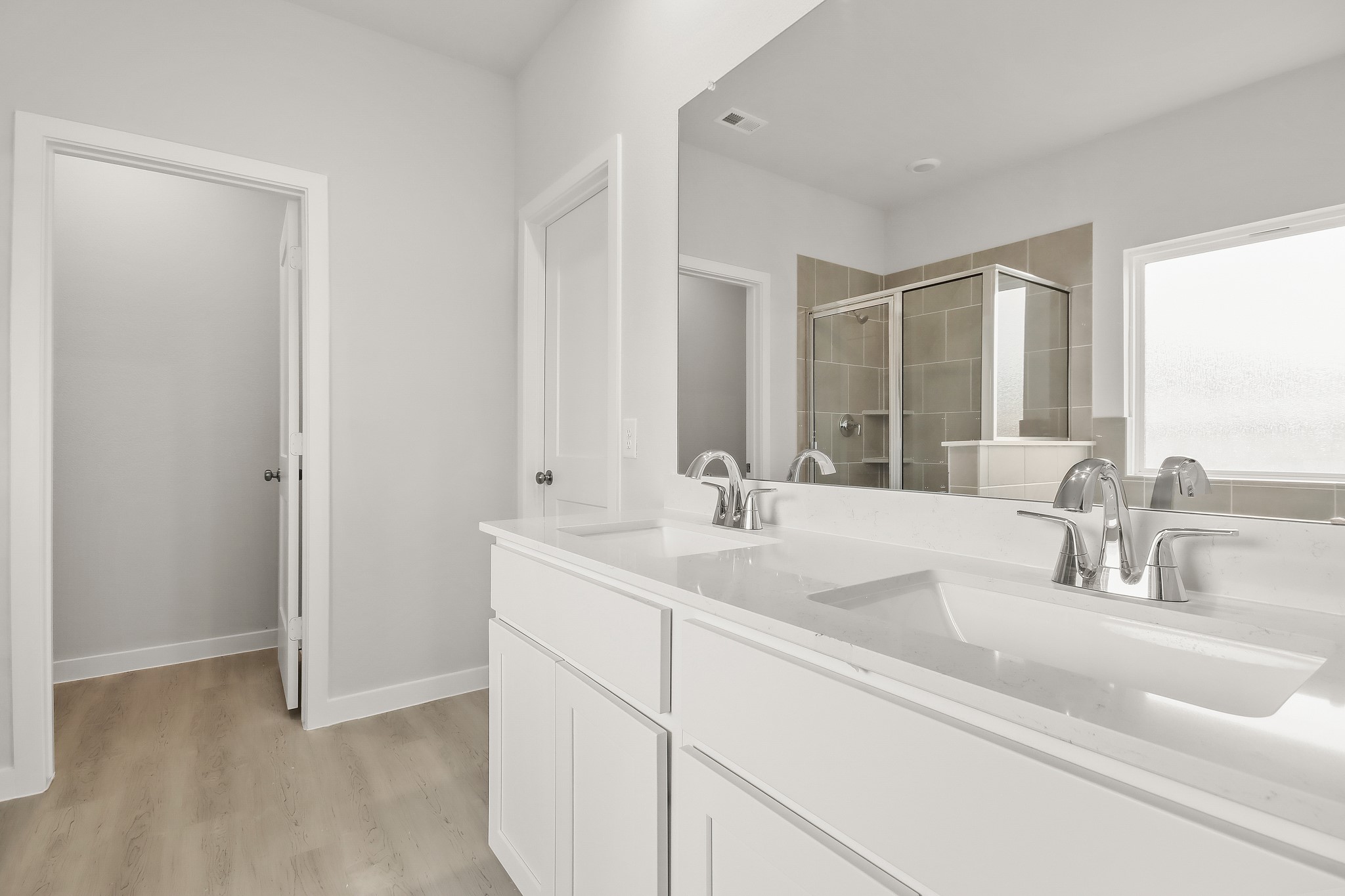 513 Wax Myrtle Way Hockley, TX 77447 - Photo 14 of 29 a bathroom with double vanity sink a mirror and a window