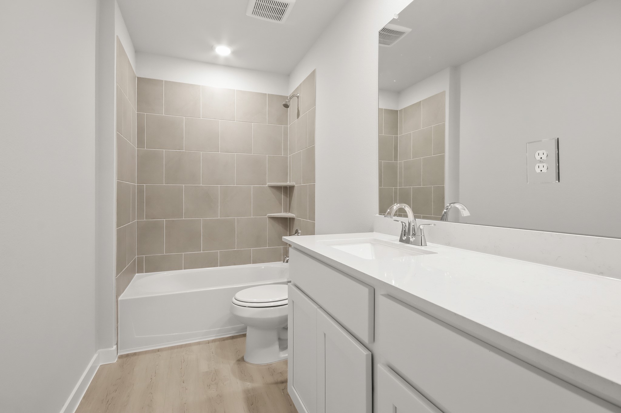 513 Wax Myrtle Way Hockley, TX 77447 - Photo 19 of 29 a bathroom with a sink a toilet and a large mirror