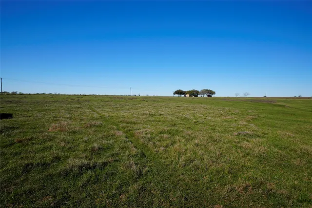 a view of a lake with a yard
