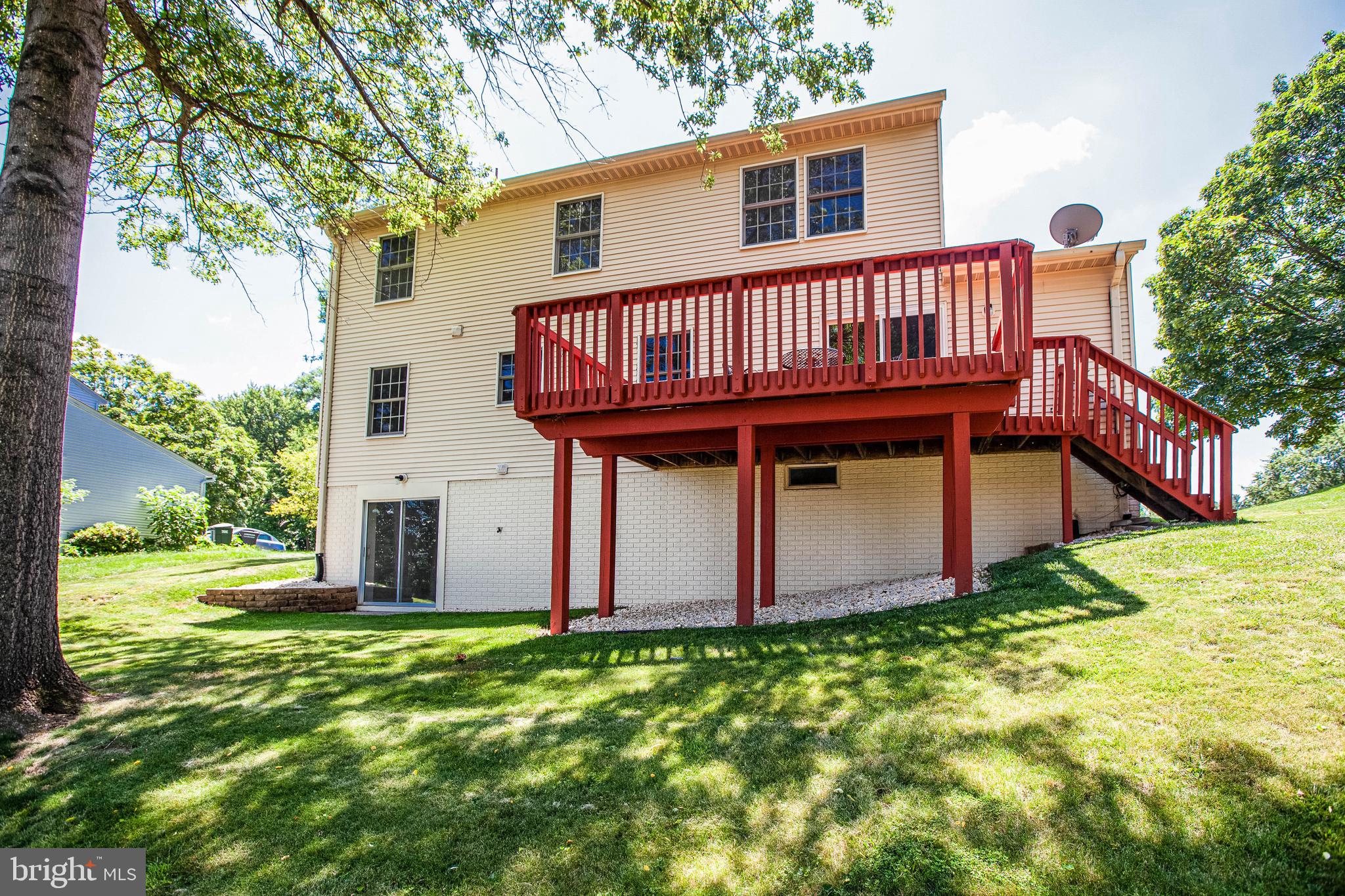 1911 East Beech Road Sterling, VA 20164 - Photo 29 of 31 Back yard and back of house with deck.