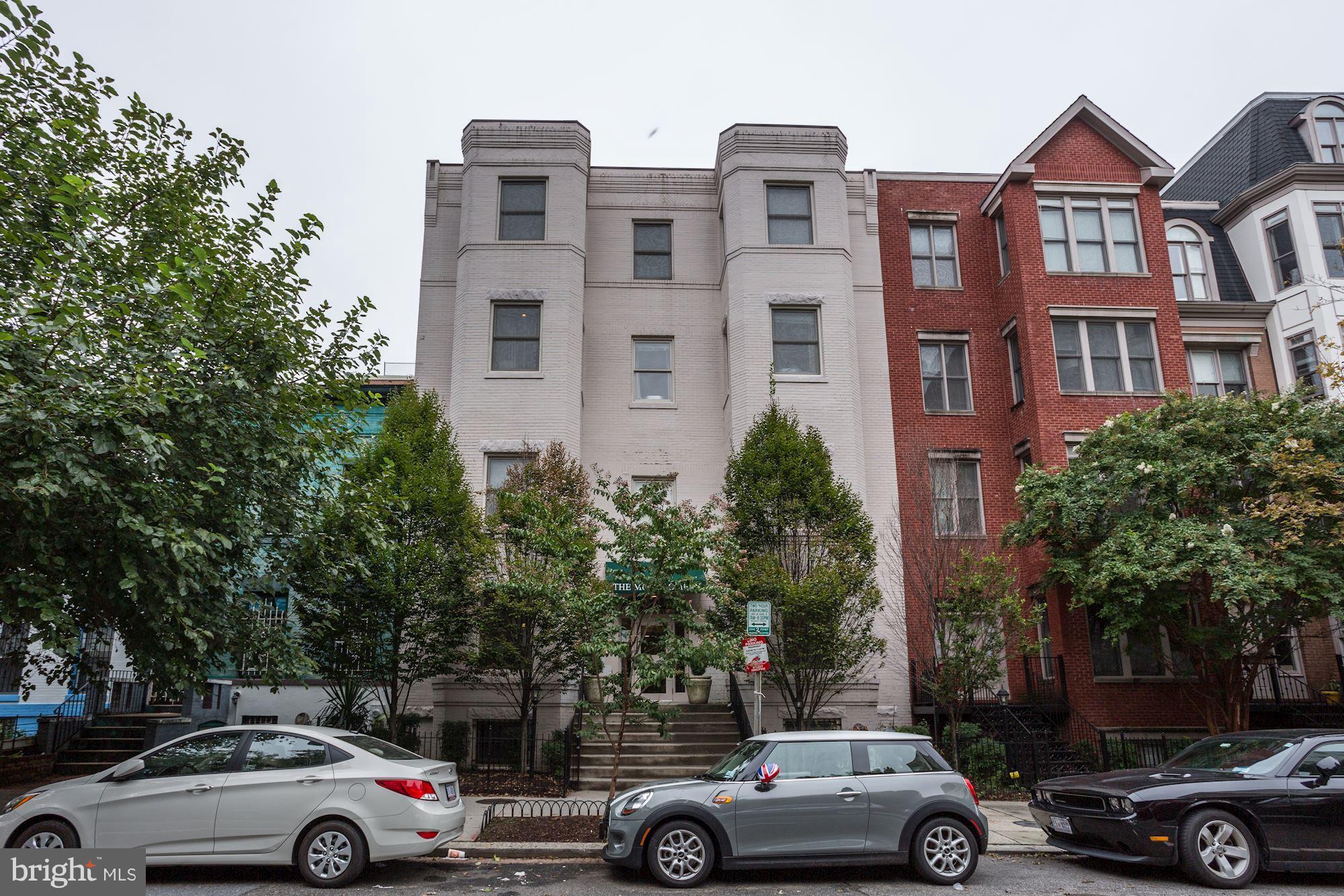1229 12th Street Northwest, Unit 201 Washington, DC 20005 - Photo 2 of 29 a view of cars parked in front of a building