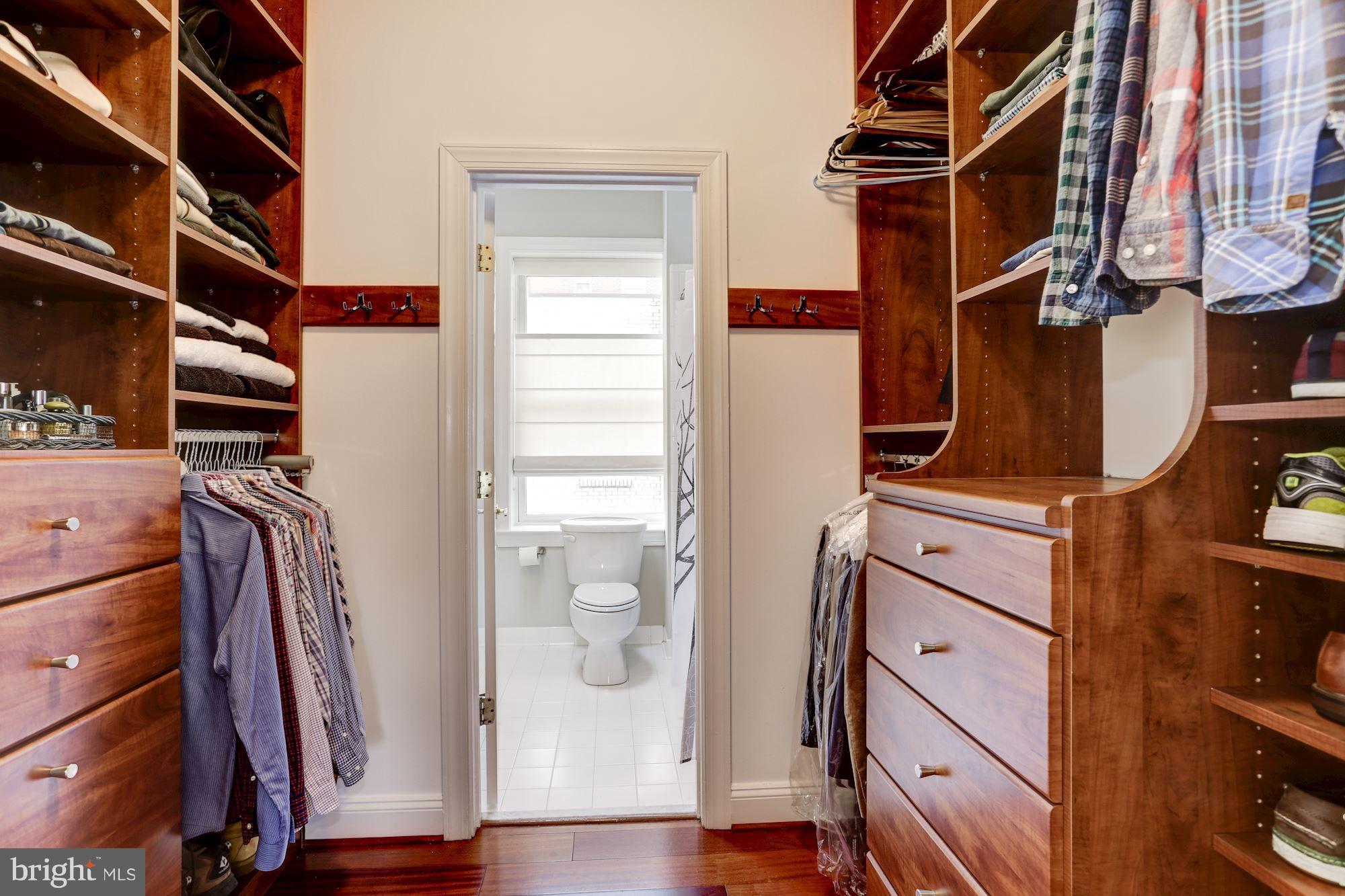 1229 12th Street Northwest, Unit 201 Washington, DC 20005 - Photo 19 of 29 a view of walk in closet with clothes and shoes