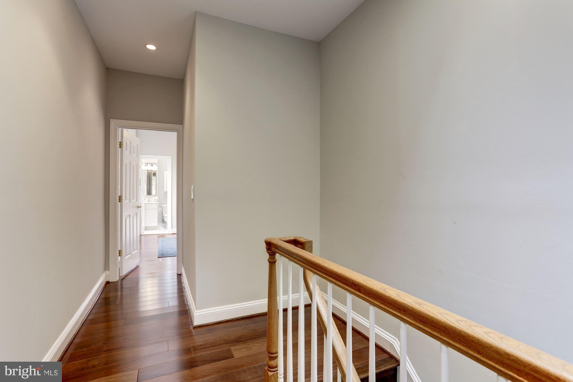 1229 12th Street Northwest, Unit 201 Washington, DC 20005 - Photo 21 of 29 a view of a hallway with wooden floor