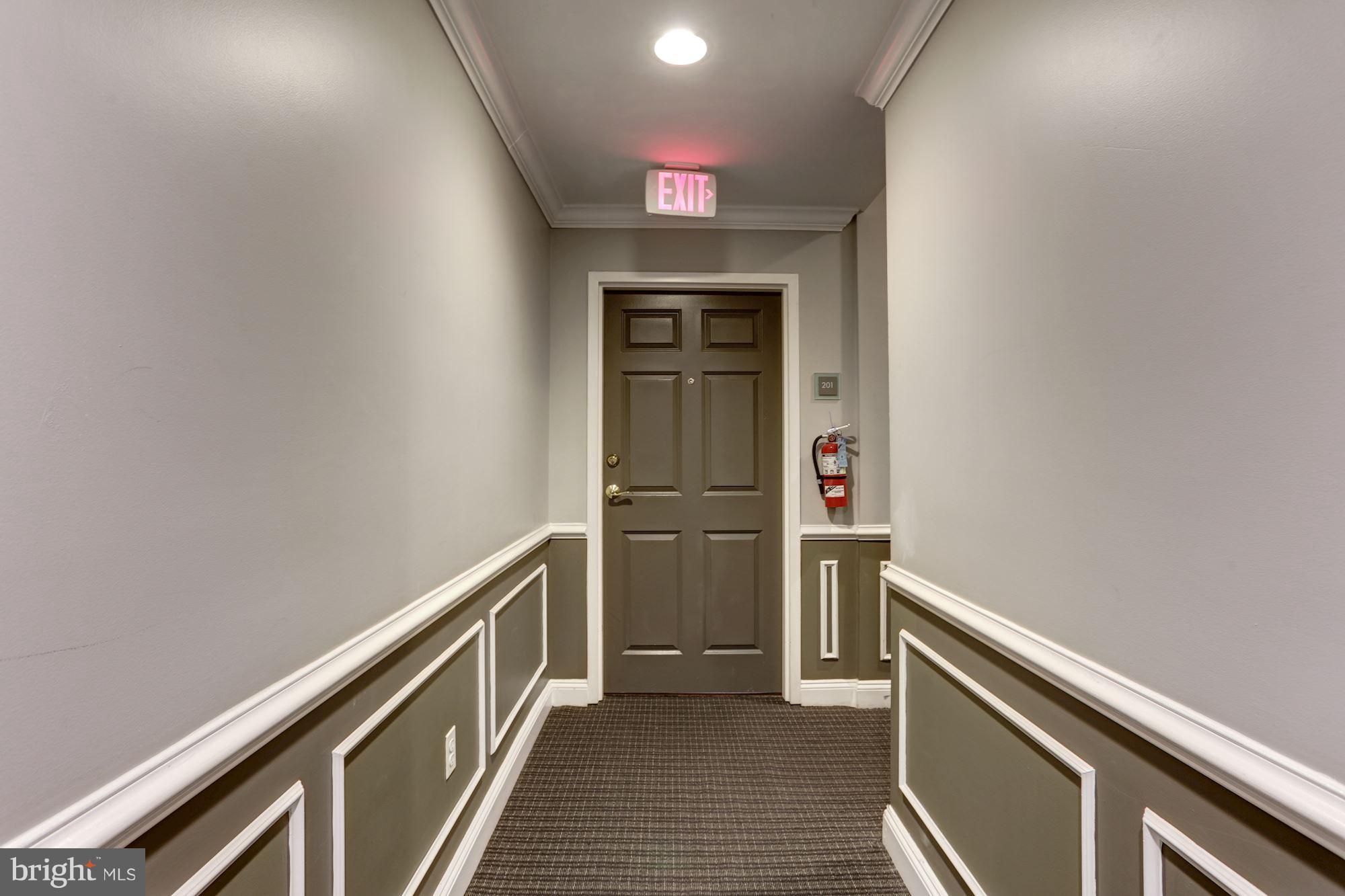 1229 12th Street Northwest, Unit 201 Washington, DC 20005 - Photo 4 of 29 a view of hallway with stairs