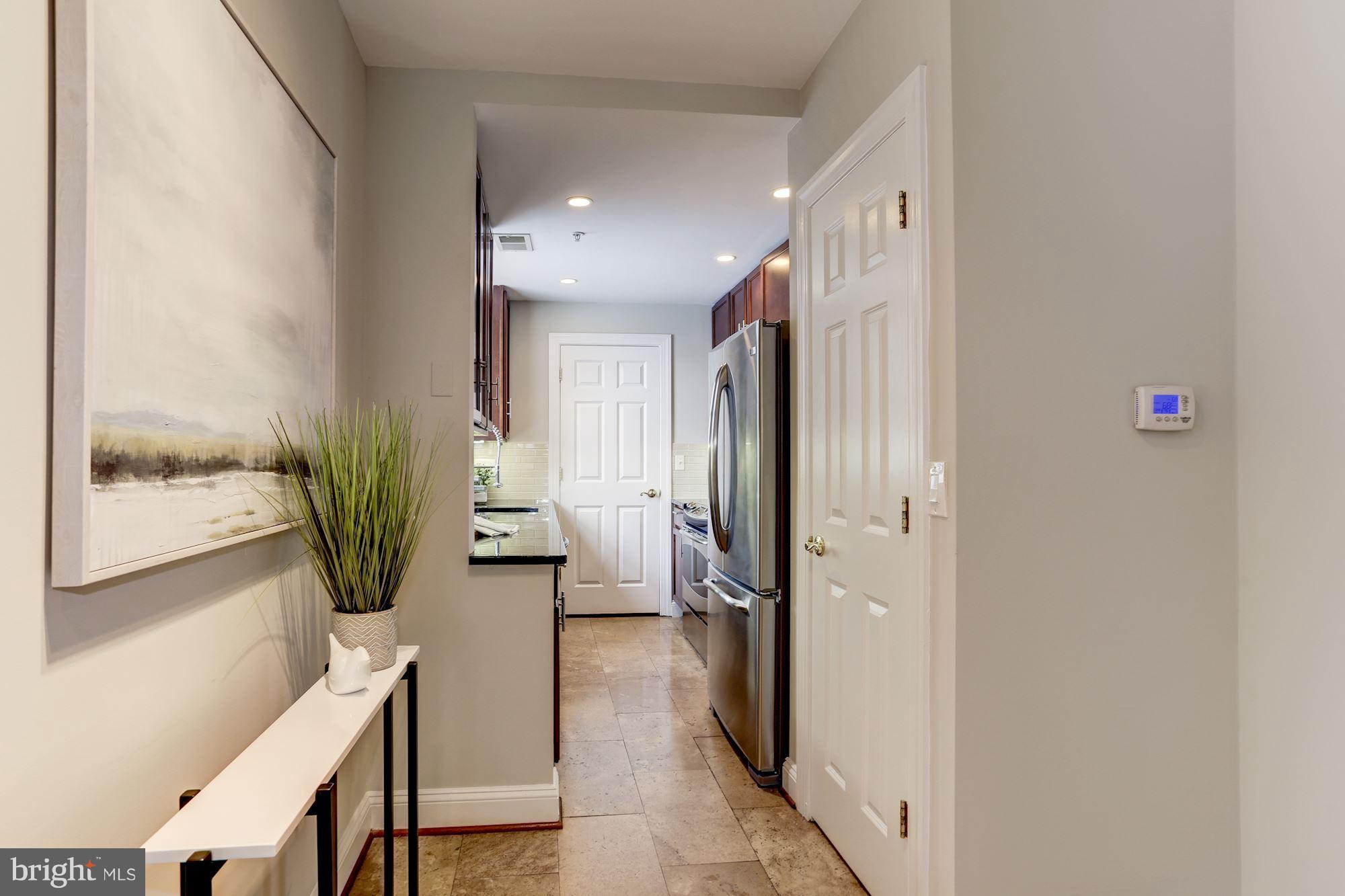 1229 12th Street Northwest, Unit 201 Washington, DC 20005 - Photo 5 of 29 a view of a hallway view with living room
