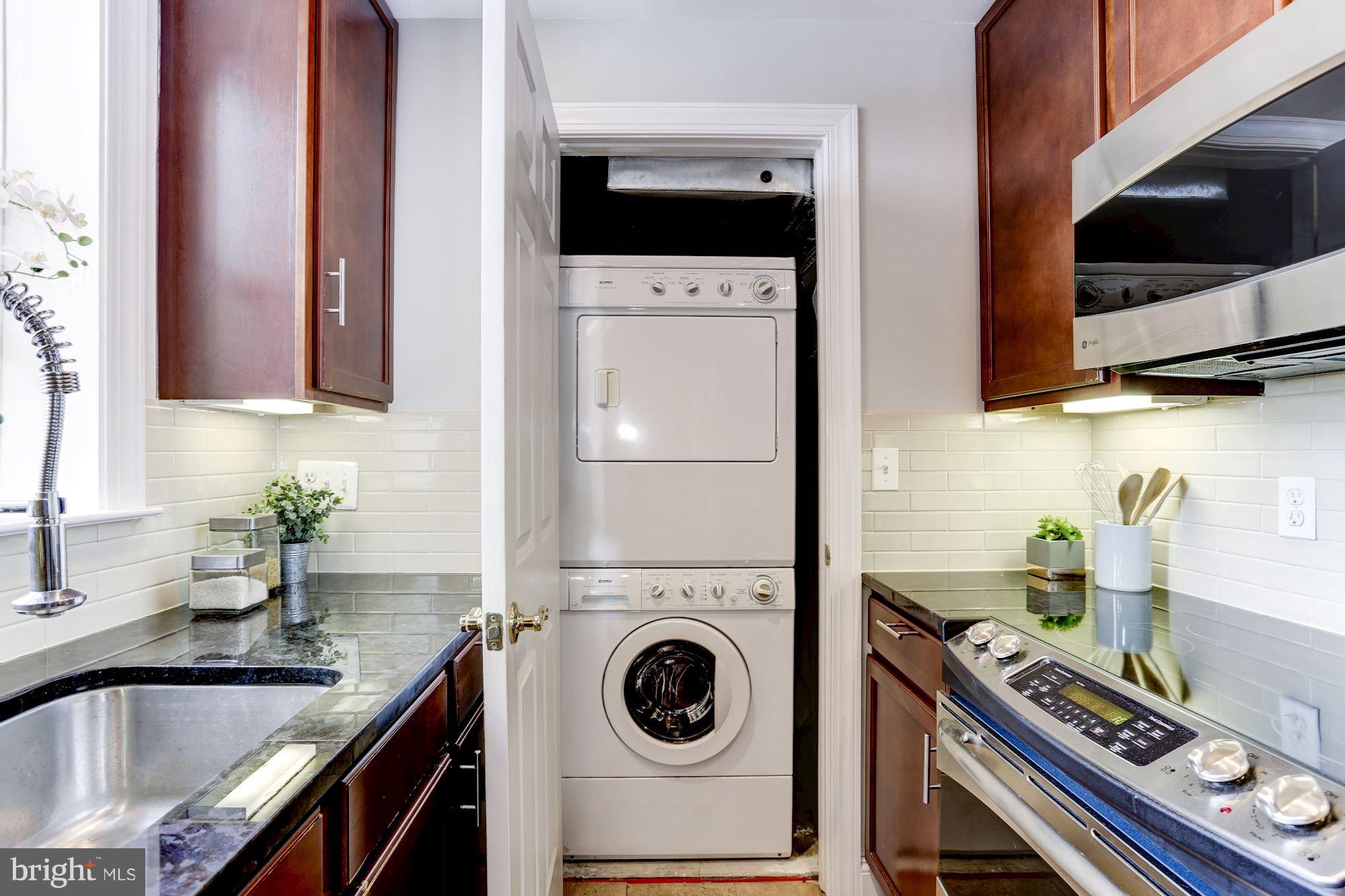 1229 12th Street Northwest, Unit 201 Washington, DC 20005 - Photo 7 of 29 a kitchen with a stove and a microwave