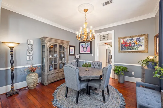 a dining room with furniture a livingroom and wooden floor
