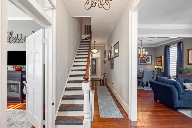 a view of a livingroom with furniture and entryway