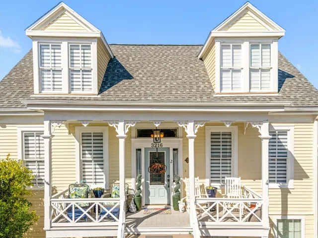 a front view of a house with a large window