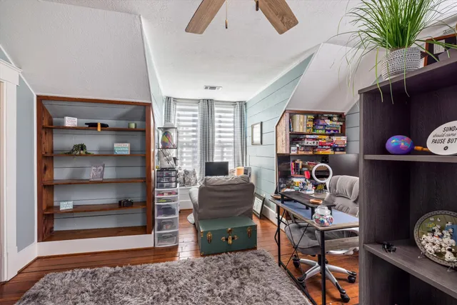 a view of a chairs and table in the balcony
