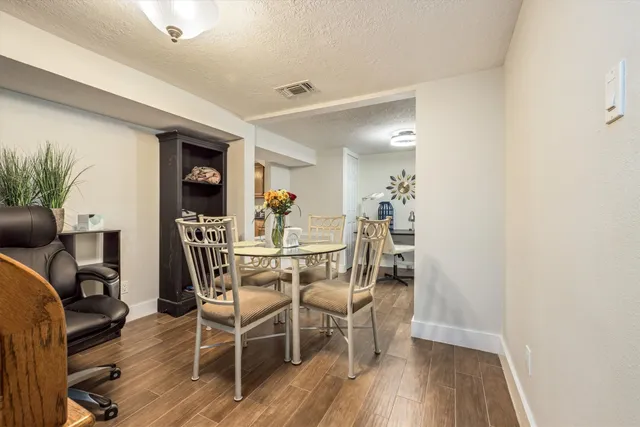 a kitchen with granite countertop cabinets stainless steel appliances a sink and a window