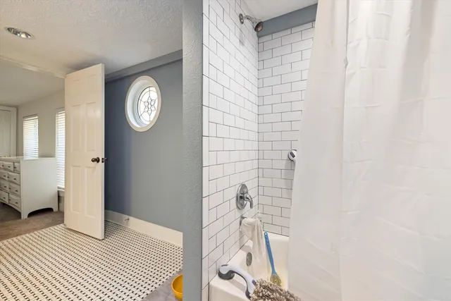 a view of washer and dryer with kitchen in the background