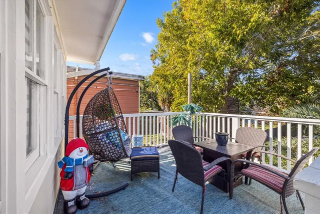 a view of a balcony with chairs