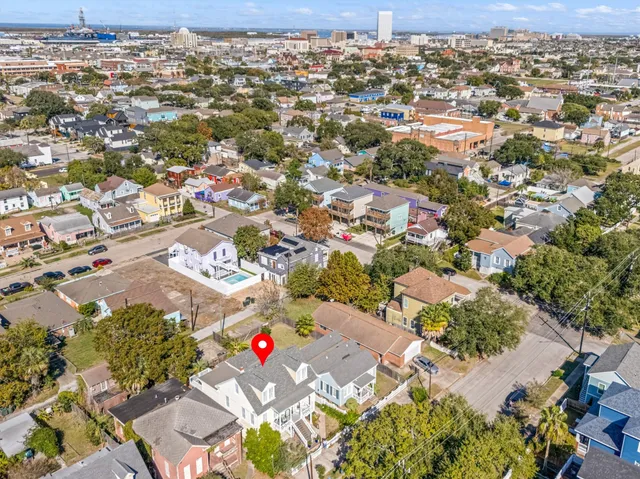 an aerial view of residential houses with outdoor space