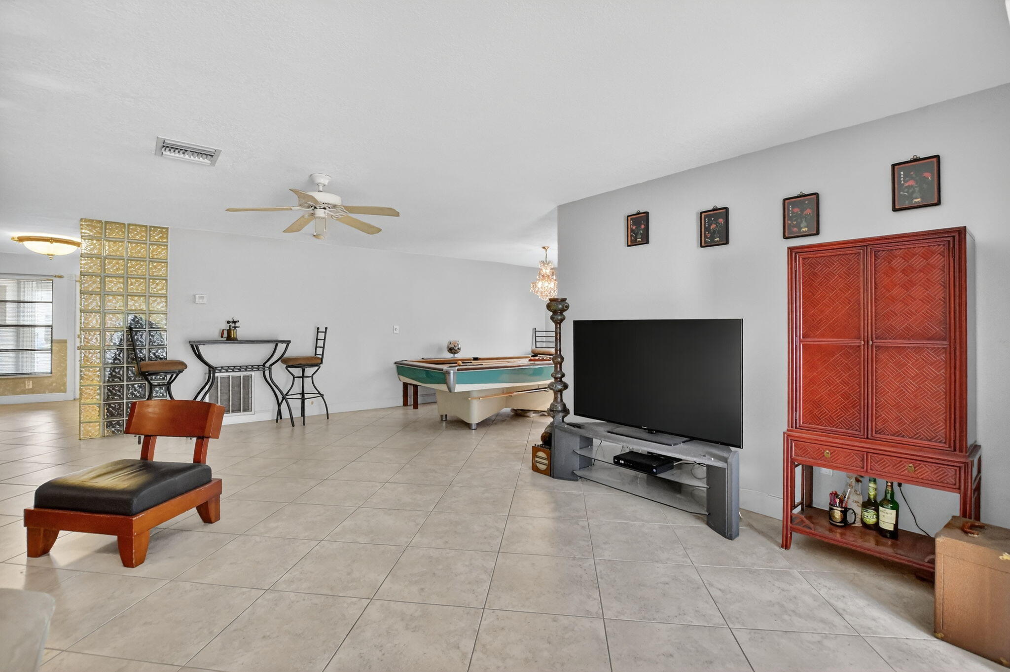 23153 Southwest 60th Way Boca Raton, FL 33428 - Photo 12 of 57 a living room with furniture and a flat screen tv