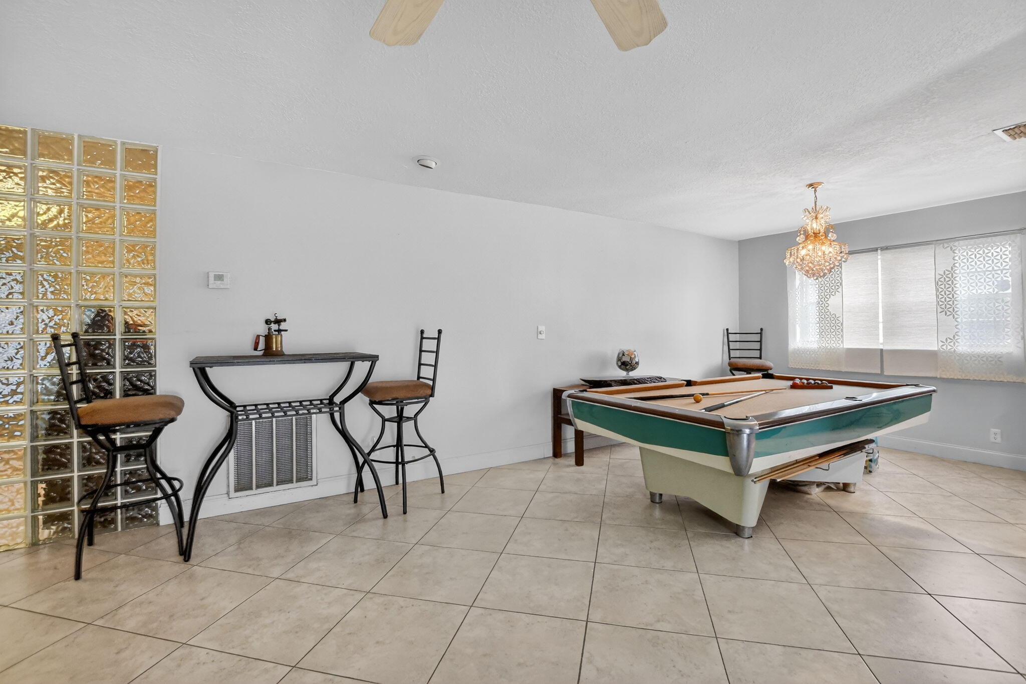 23153 Southwest 60th Way Boca Raton, FL 33428 - Photo 13 of 57 a living room with furniture and a table