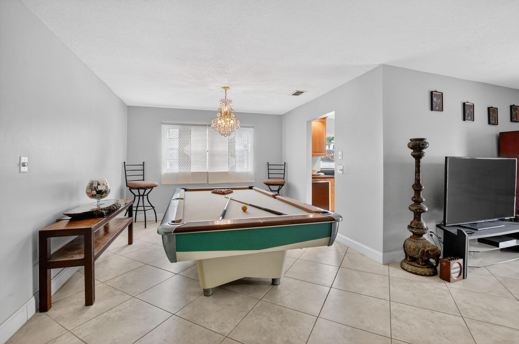 23153 Southwest 60th Way Boca Raton, FL 33428 - Photo 14 of 57 a living room with furniture and a flat screen tv
