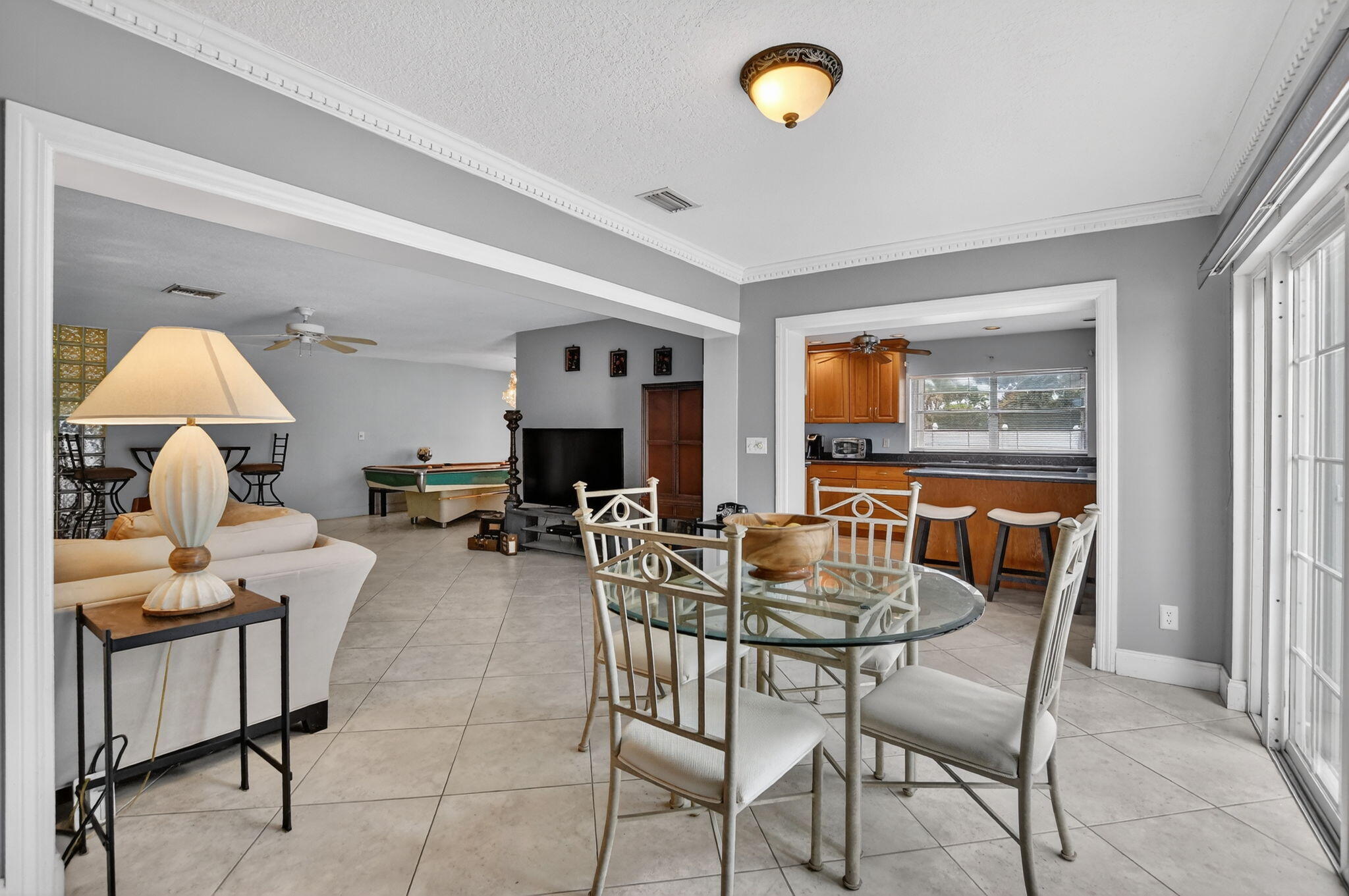23153 Southwest 60th Way Boca Raton, FL 33428 - Photo 22 of 57 a dining room with furniture and a large window