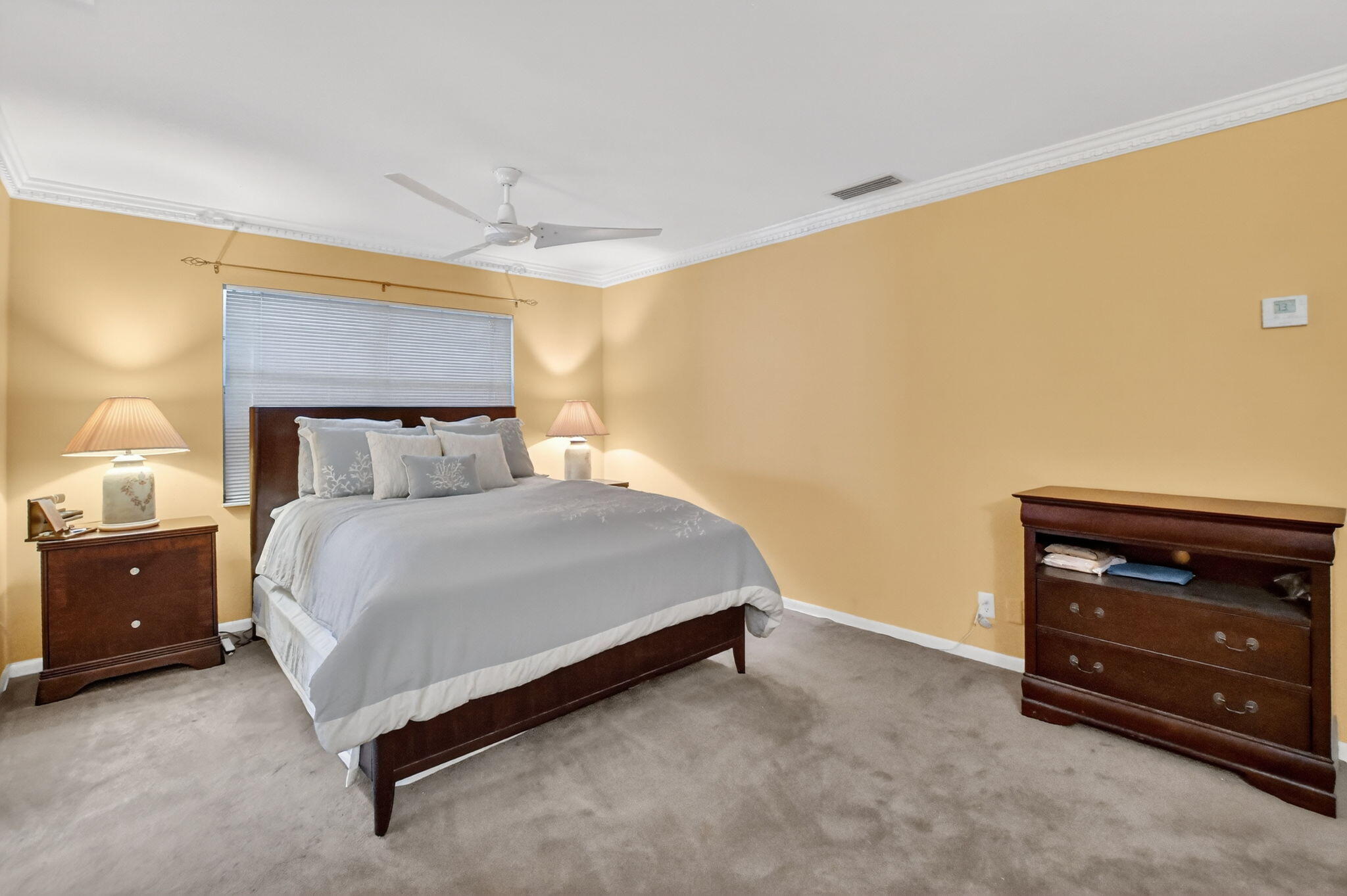 23153 Southwest 60th Way Boca Raton, FL 33428 - Photo 27 of 57 a bedroom with a bed and a dresser