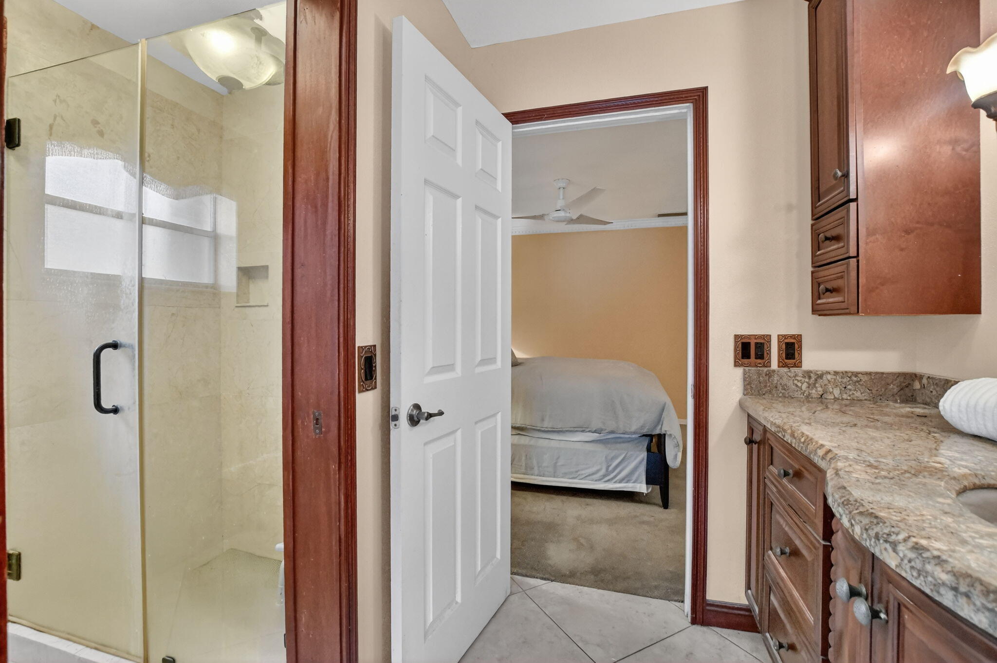 23153 Southwest 60th Way Boca Raton, FL 33428 - Photo 31 of 57 a en suite bathroom with a granite countertop sink and a mirror
