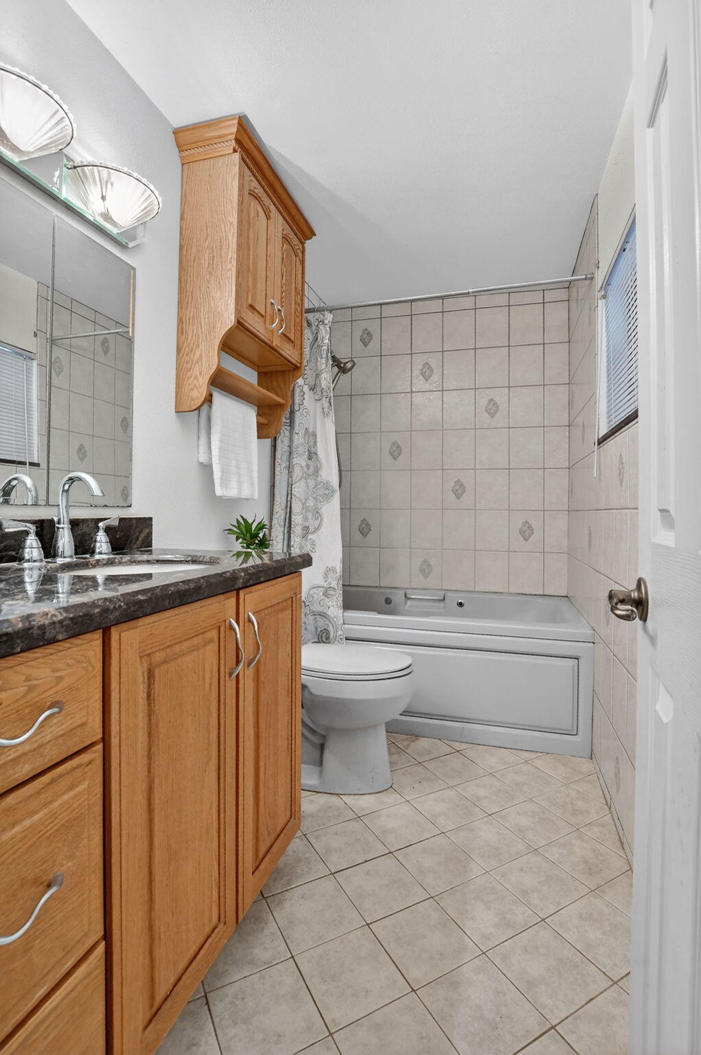 23153 Southwest 60th Way Boca Raton, FL 33428 - Photo 36 of 57 a bathroom with a sink a toilet and bathtub