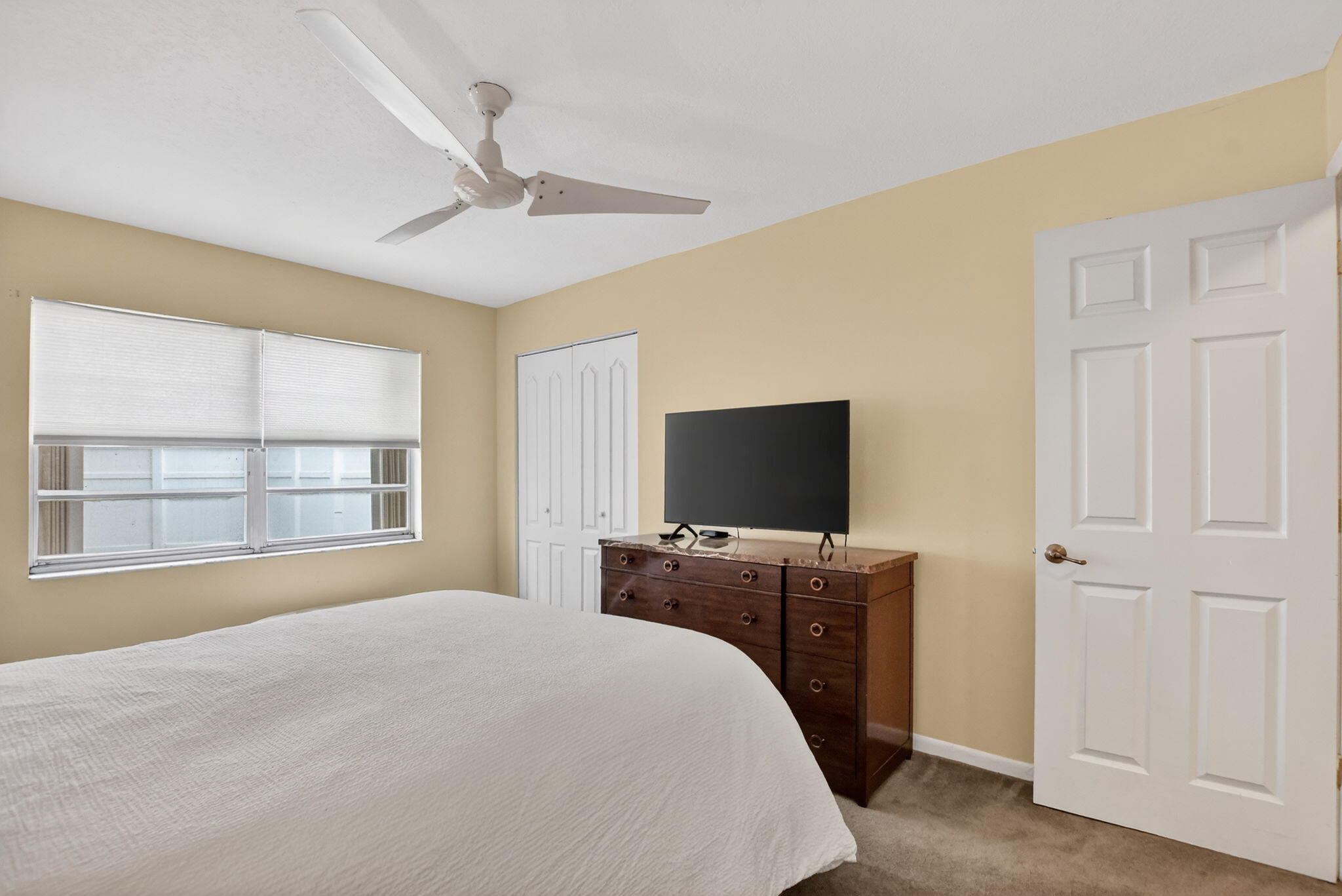 23153 Southwest 60th Way Boca Raton, FL 33428 - Photo 39 of 57 a bedroom with a bed and a flat screen tv
