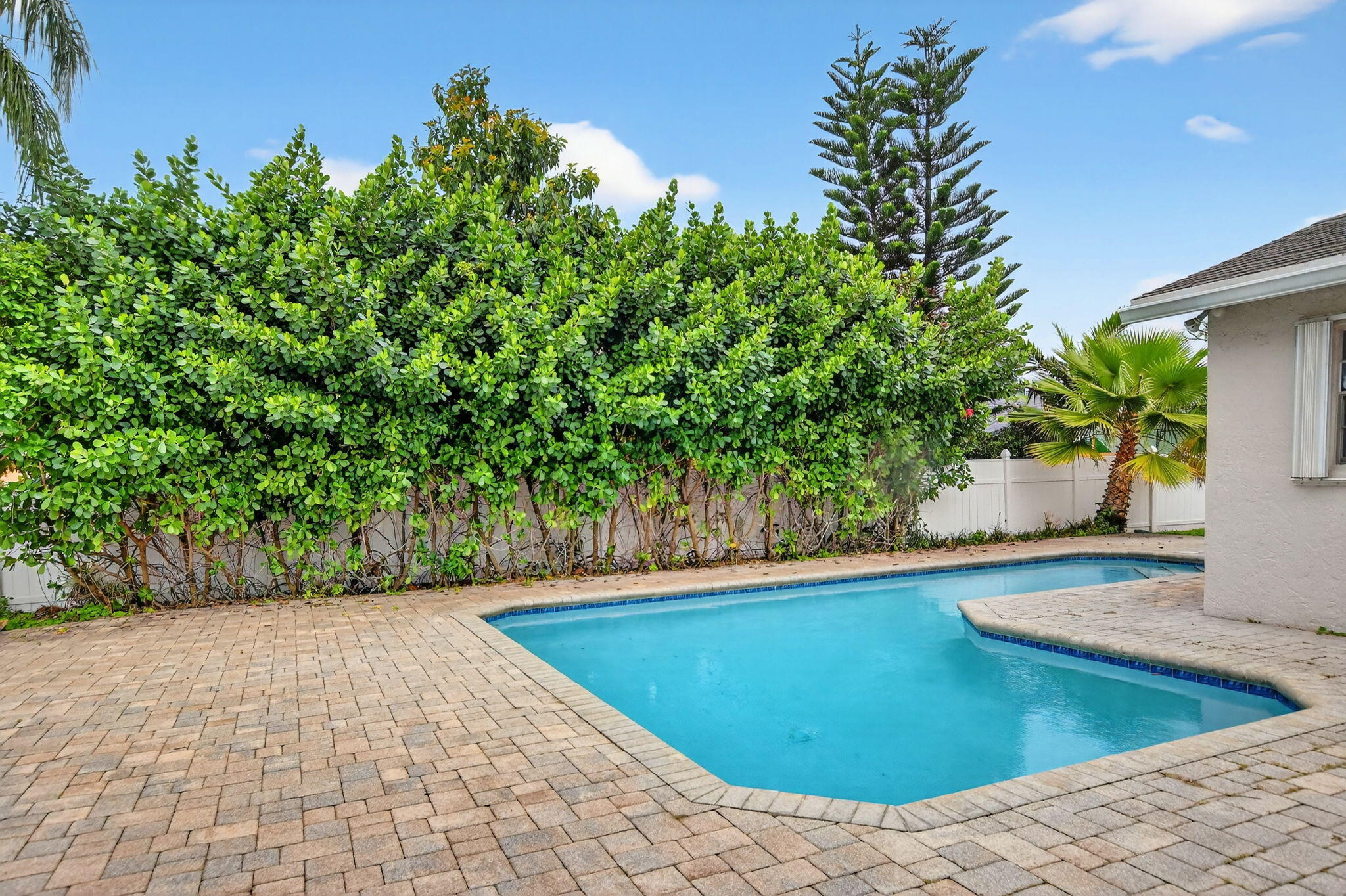 23153 Southwest 60th Way Boca Raton, FL 33428 - Photo 41 of 57 a view of a swimming pool with an outdoor space