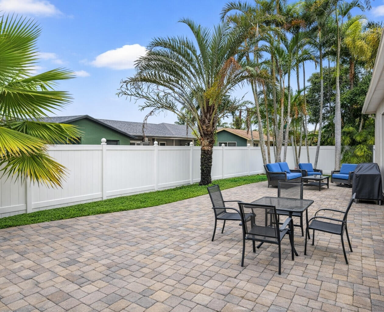 23153 Southwest 60th Way Boca Raton, FL 33428 - Photo 42 of 57 a view of a backyard with a patio and swimming pool