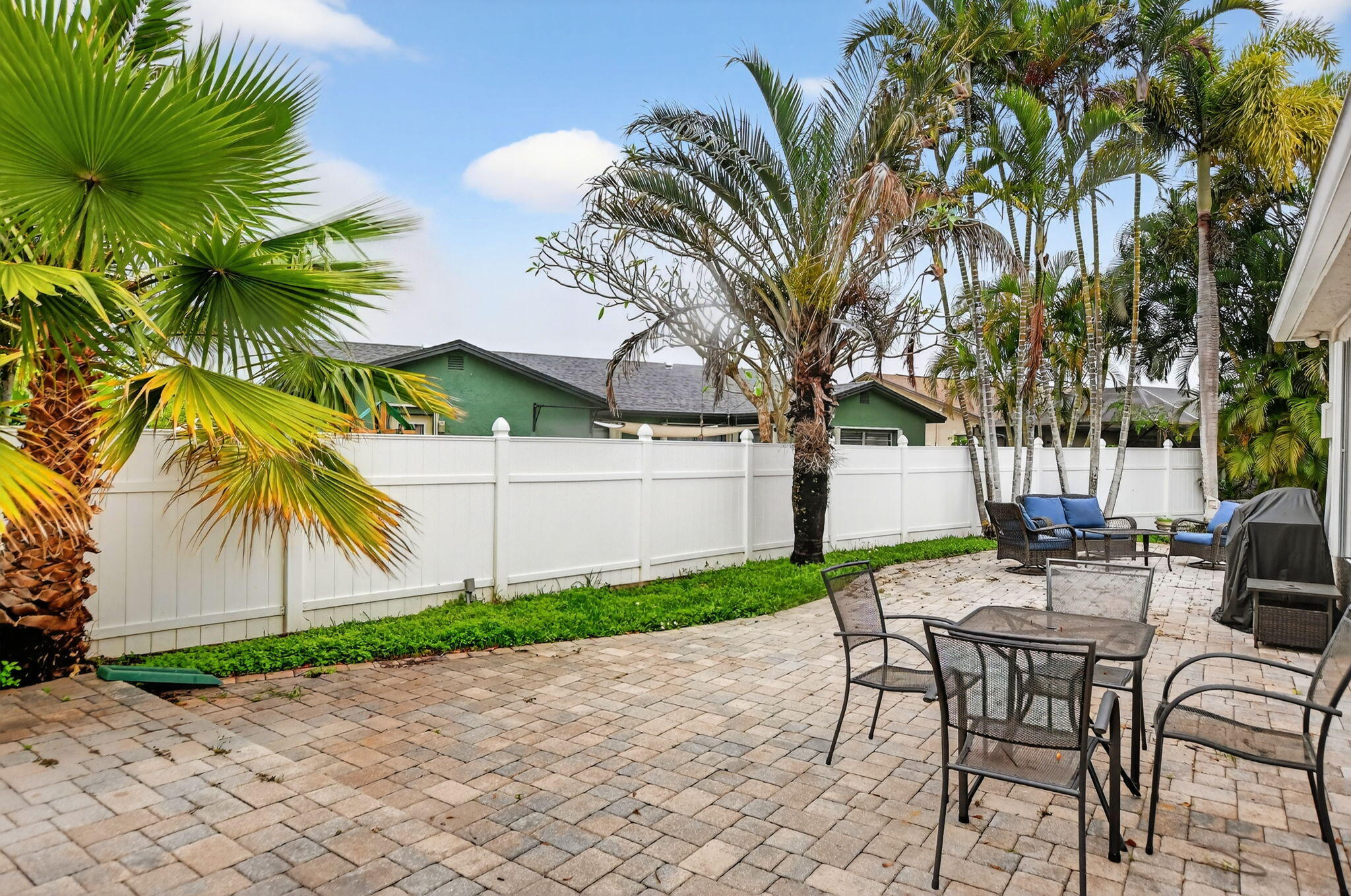 23153 Southwest 60th Way Boca Raton, FL 33428 - Photo 43 of 57 a view of a backyard with a garden and furniture