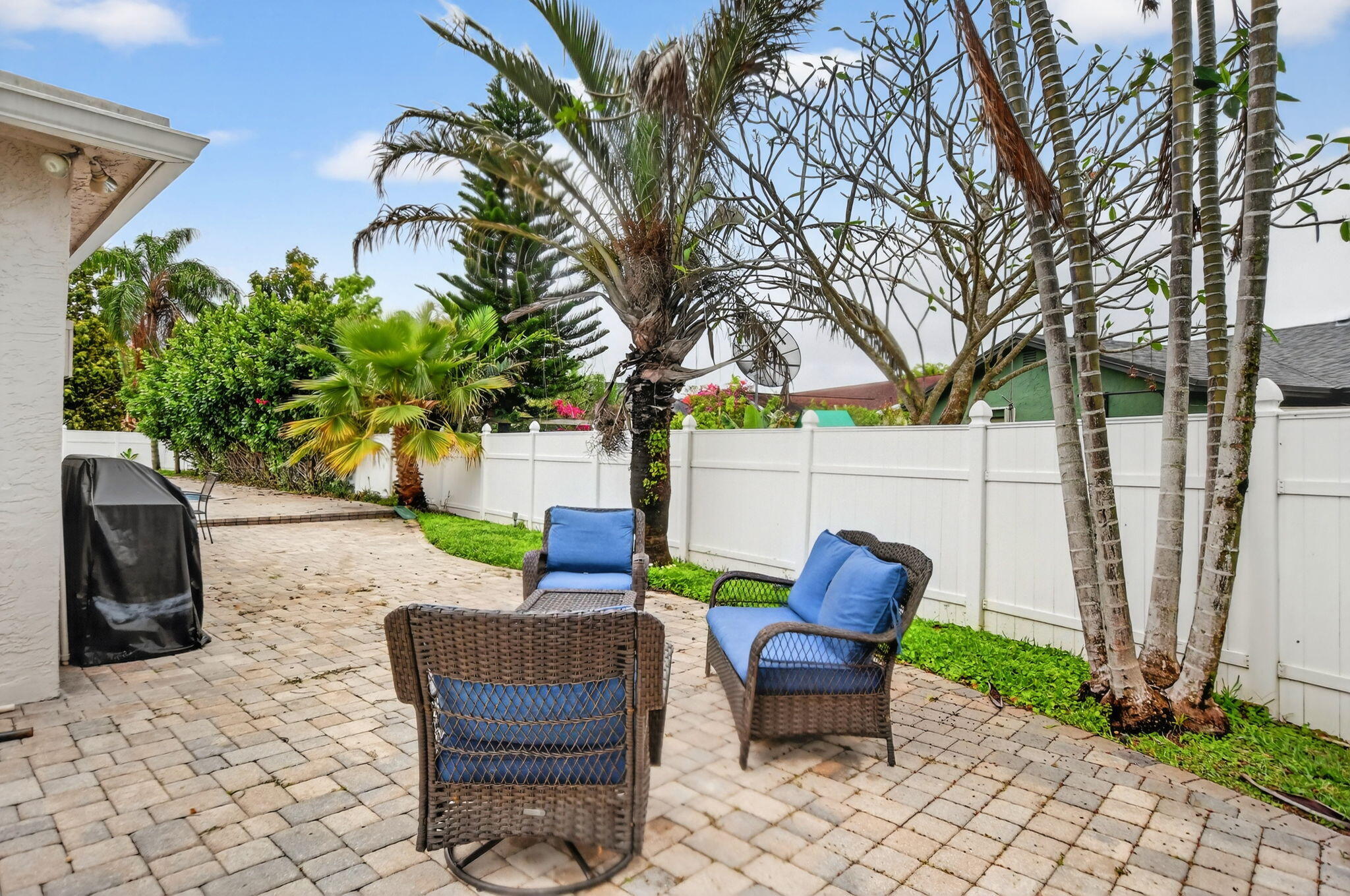 23153 Southwest 60th Way Boca Raton, FL 33428 - Photo 44 of 57 a view of a yard with furniture and a fire pit