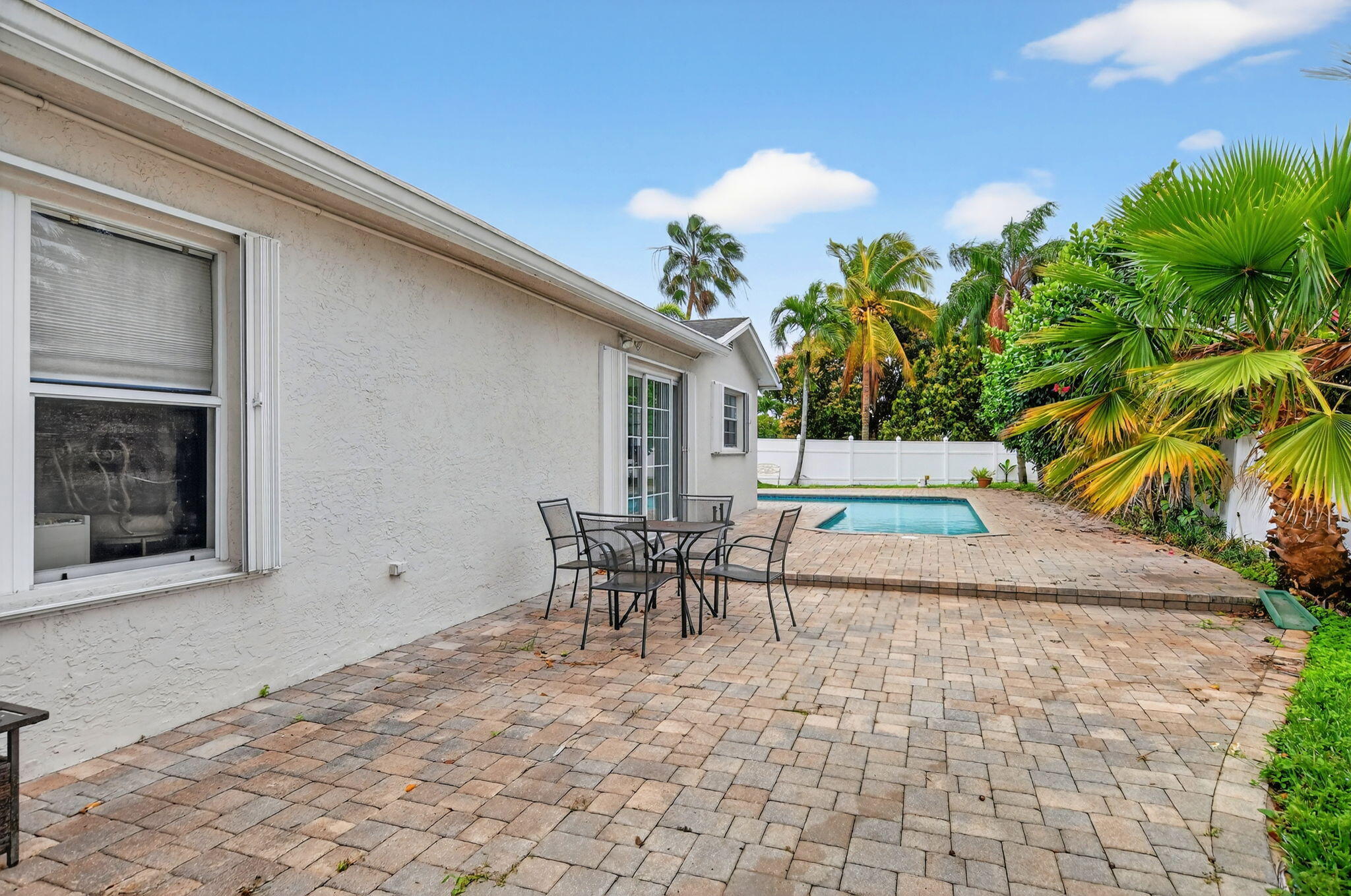 23153 Southwest 60th Way Boca Raton, FL 33428 - Photo 46 of 57 a patio with table and chairs and potted plants
