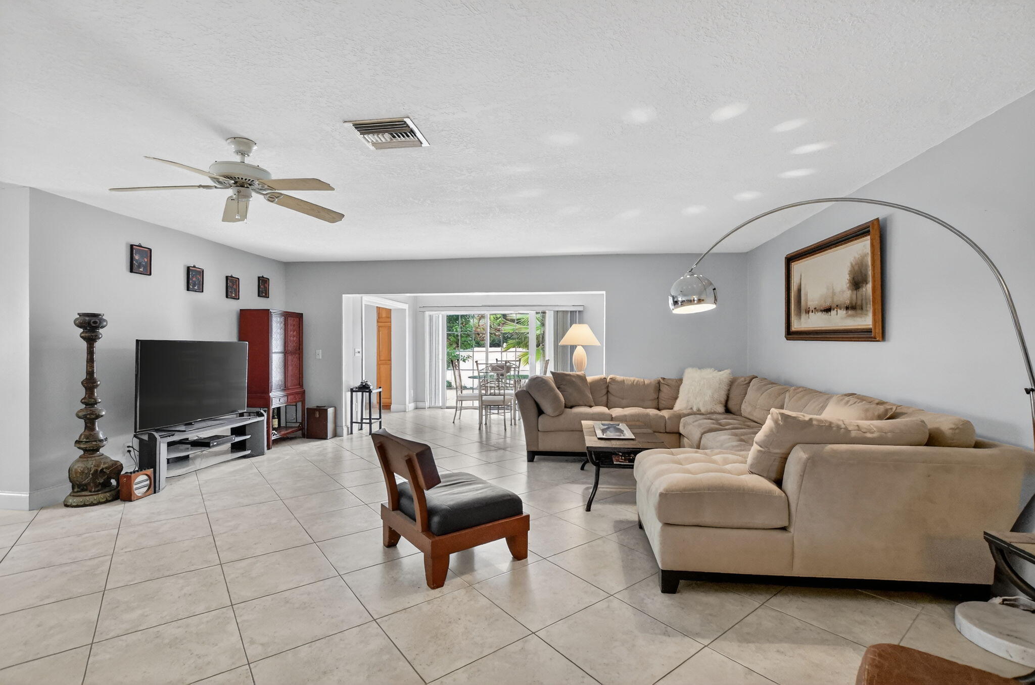 23153 Southwest 60th Way Boca Raton, FL 33428 - Photo 9 of 57 a living room with furniture and a flat screen tv