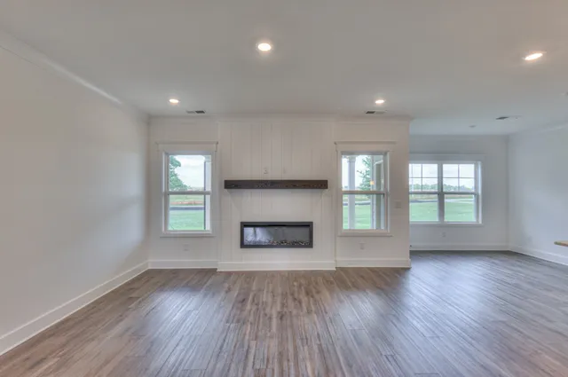 a kitchen with kitchen island a sink stainless steel appliances and cabinets