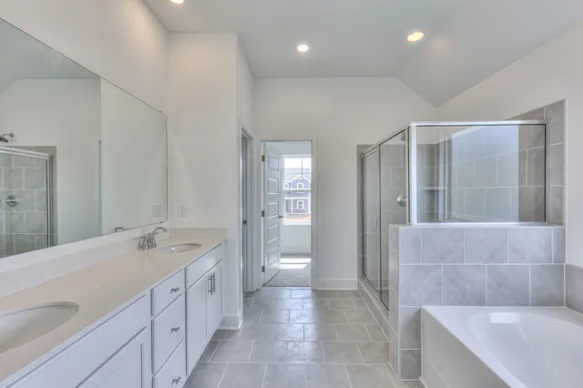 a bathroom with a bathtub and a shower