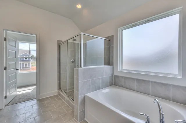 a bathroom with a glass shower door