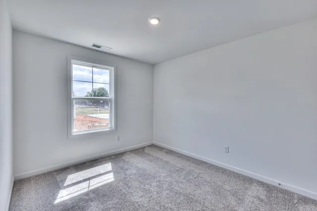 a view of a bathroom with a glass shower door