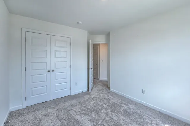 a view of a brick house with a yard