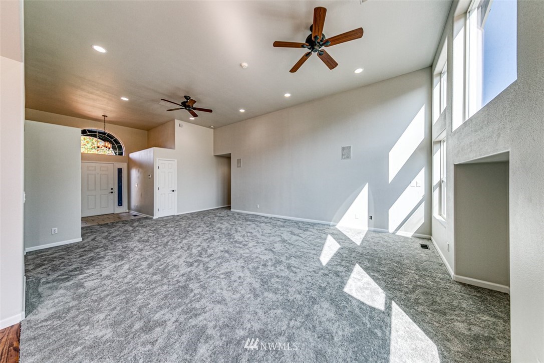 64 Bon Jon View Way Sequim, WA 98382 - Photo 14 of 40 a view of a hallway with a ceiling fan