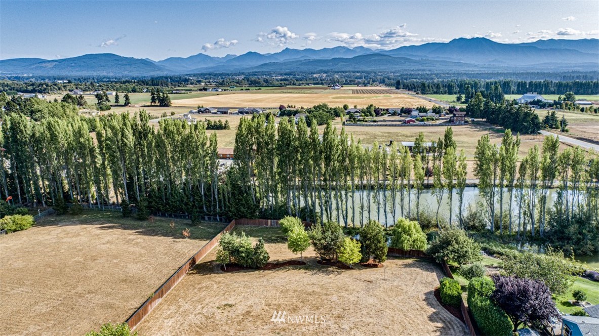 64 Bon Jon View Way Sequim, WA 98382 - Photo 8 of 40 a view of a lake with a mountain in the background