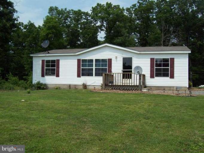 355 Timber Ridge Berkeley Springs, WV 25411 - Photo 8 of 19 a front view of a house with a garden