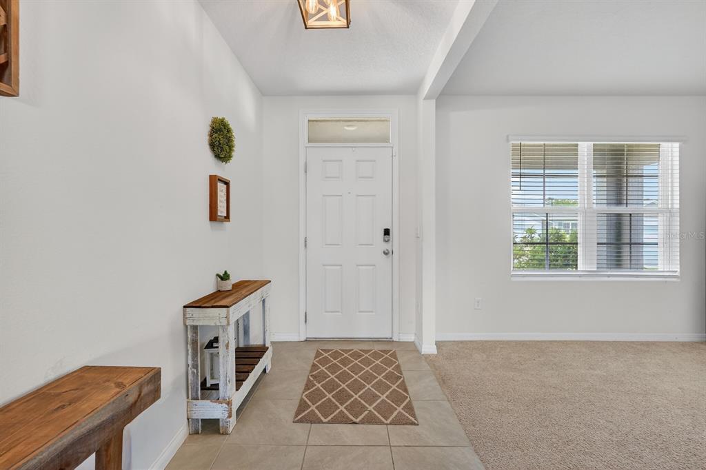 1809 Myrtlebrooke Drive Edgewater, FL 32141 - Photo 5 of 58 a bedroom with a bed and a window